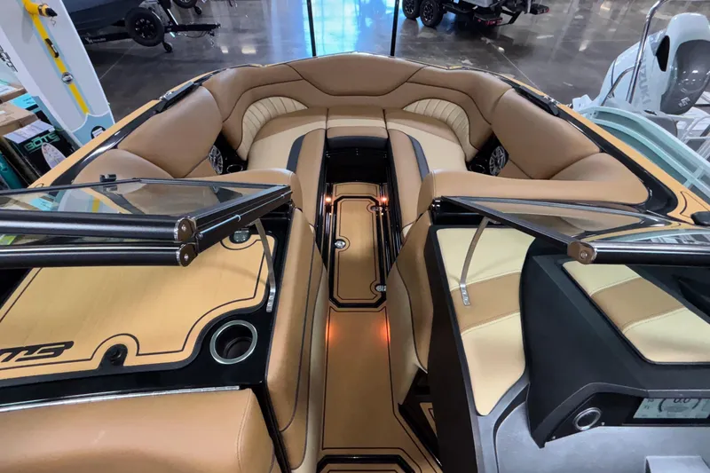 Slide: The Image of Luxurious interior of 2025 MB B52 25 Alpha boat with tan seating and sleek design. - 30