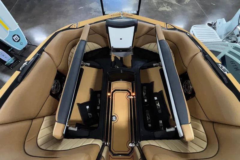 Slide: The Image of Luxurious interior of 2025 MB B52 25 Alpha boat with tan seating and sleek design. - 36