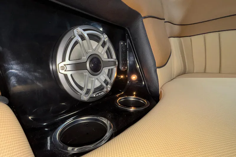 Slide: The Image of Interior of 2025 MB B52 25 Alpha featuring JL Audio speaker and cup holders. - 39