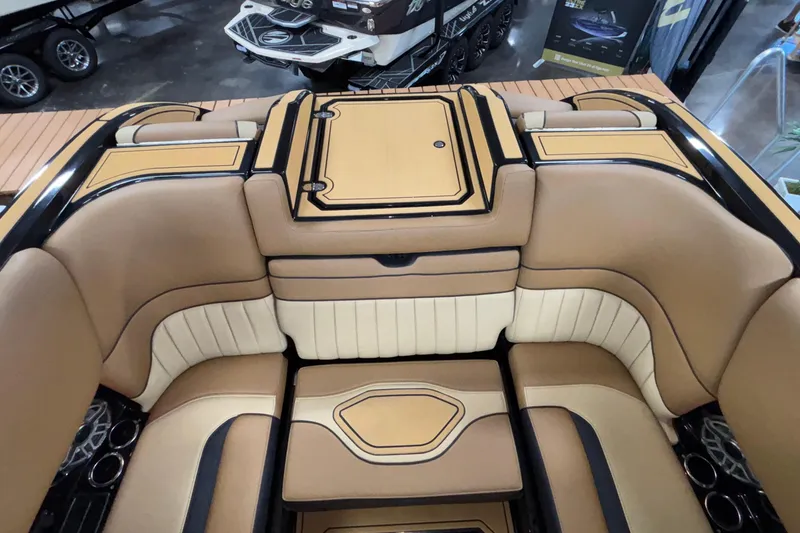 Slide: The Image of Luxurious interior of 2025 MB B52 25 Alpha boat with tan and black seating. - 44