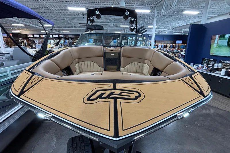 Slide: The Image of 2025 MB B52 25 Alpha boat with luxurious seating in showroom. - 55