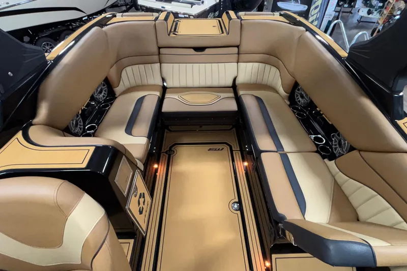 Slide: The Image of Luxurious interior of 2025 MB B52 25 Alpha boat with tan leather seating. - 6