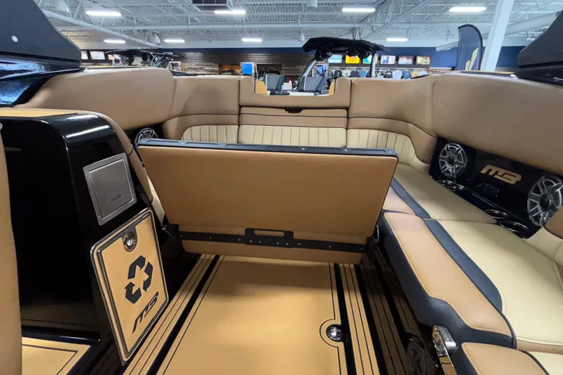 Slide: The Image of Interior of 2025 MB B52 25 Alpha boat with tan seating and modern design. - 60