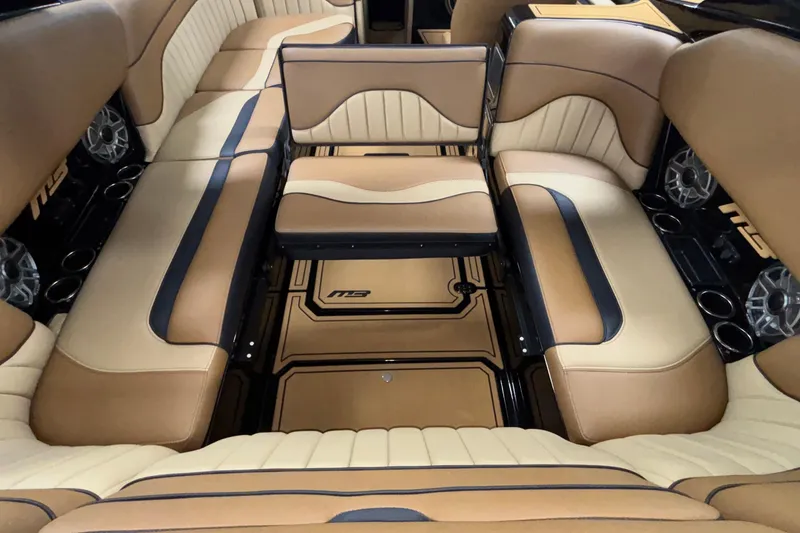 Slide: The Image of Luxurious interior of 2025 MB B52 25 Alpha boat with tan and black seating. - 61