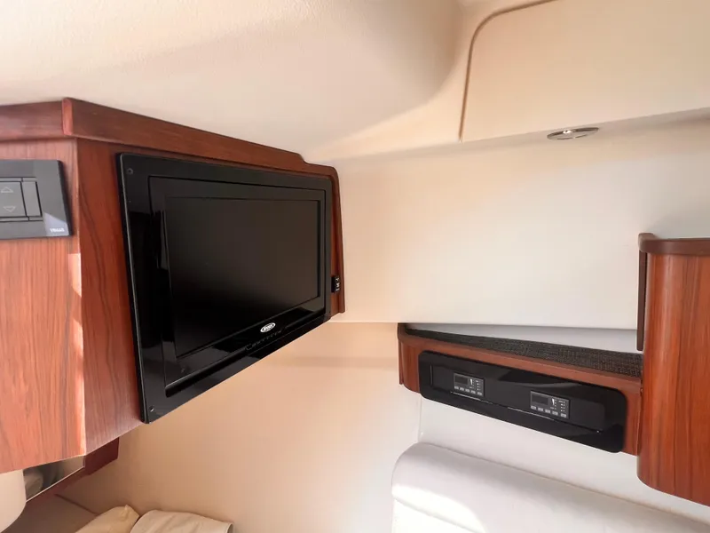 Slide: The Image of Interior of 2016 Grady-White Freedom 375 boat with TV and control panel. - 12