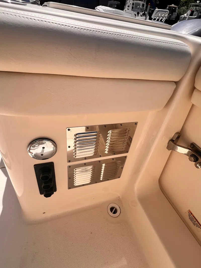 Slide: The Image of 2016 Grady-White Freedom 375 boat interior detail with vent and controls. - 14