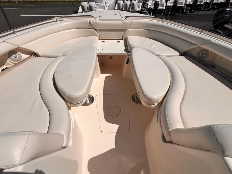 Slide: The Image of 2016 Grady-White Freedom 375 boat interior with cushioned seating and table. - 19