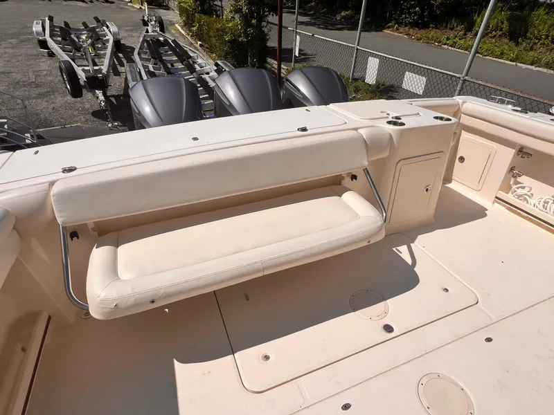 Slide: The Image of 2016 Grady-White Freedom 375 boat interior with foldable seating and storage compartments. - 6
