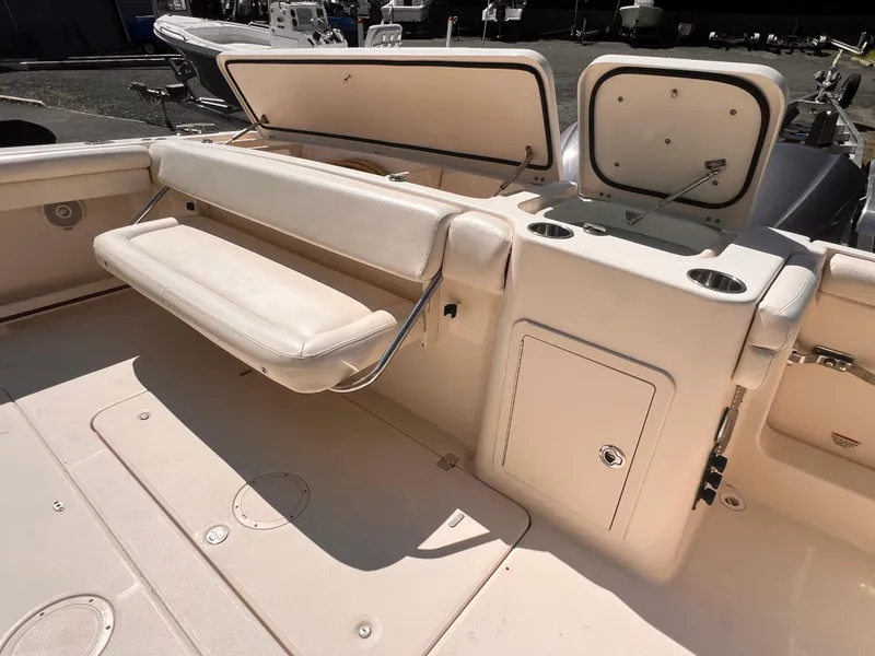 Slide: The Image of 2016 Grady-White Freedom 375 boat interior with seating and storage compartments. - 7