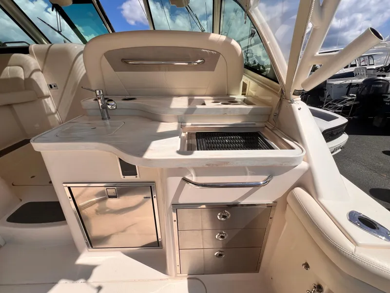 Slide: The Image of 2016 Grady-White Freedom 375 boat interior with kitchenette and grill station. - 9