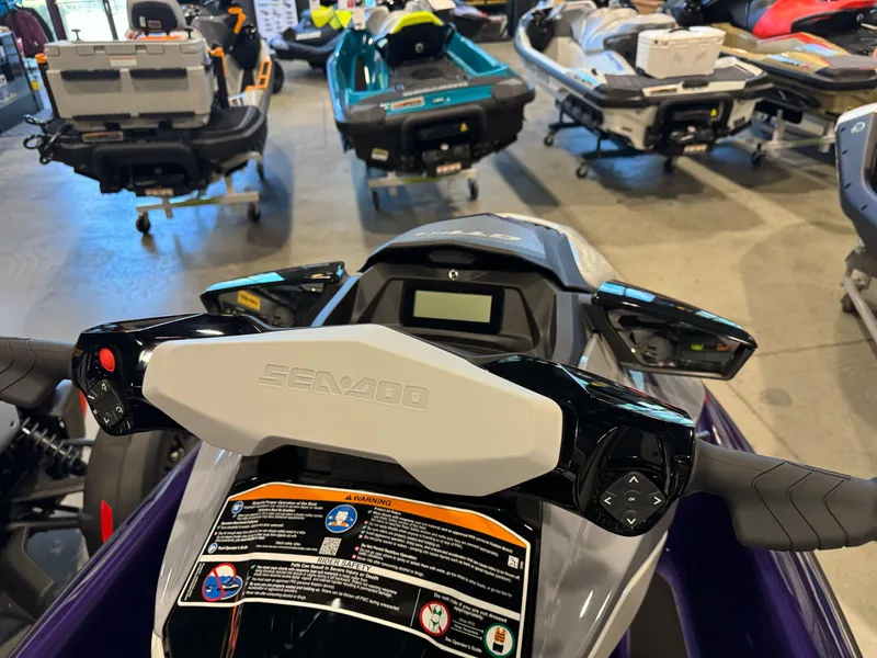 Slide: The Image of 2025 Sea-Doo GTI SE 130 dashboard and controls in a showroom setting. - 4