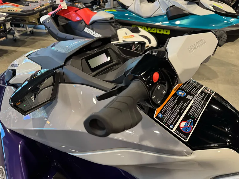 Slide: The Image of 2025 Sea-Doo GTI SE 130 jet ski handlebar and dashboard in showroom. - 6