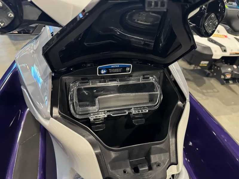 Slide: The Image of 2025 Sea-Doo GTI SE 130 storage compartment open, showcasing interior design and features. - 7