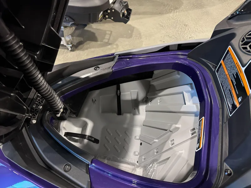 Slide: The Image of Open storage compartment of 2025 Sea-Doo GTI SE 130 watercraft, showcasing interior design. - 9