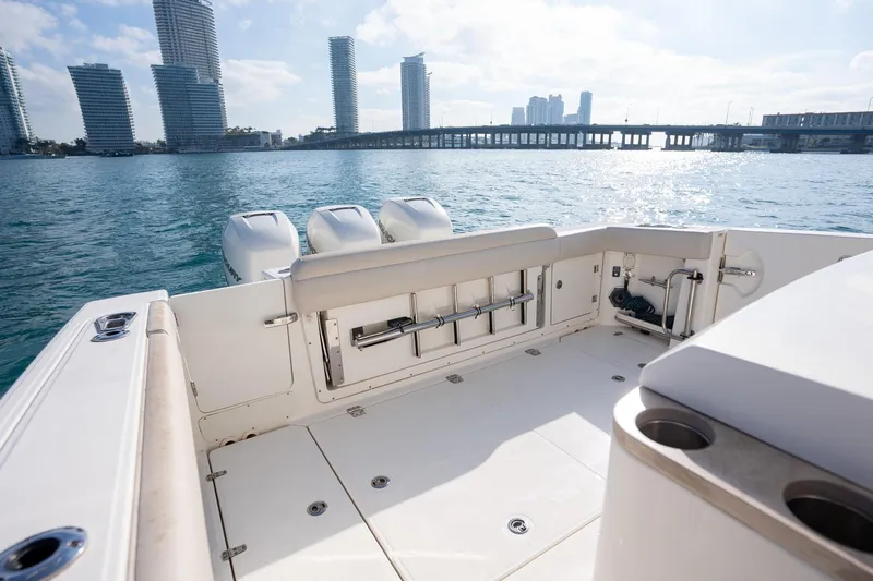 Slide: The Image of Boston Whaler 380 Outrage 2020 boat deck with city skyline and bridge in background. - 10