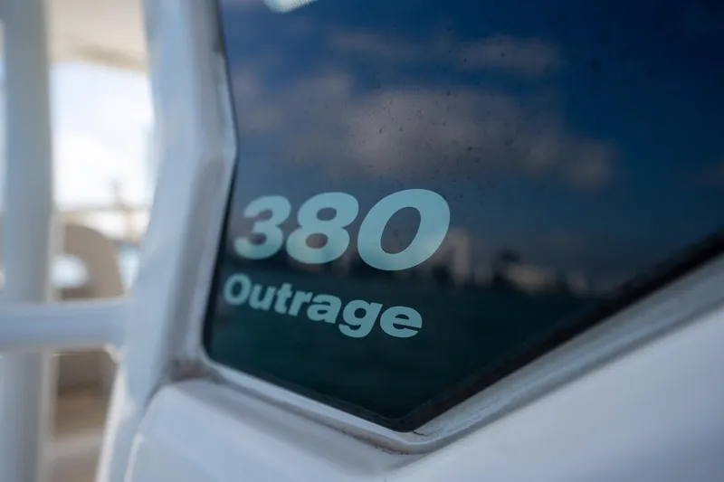 Slide: The Image of Close-up of 2020 Boston Whaler 380 Outrage boat model name on window. - 13