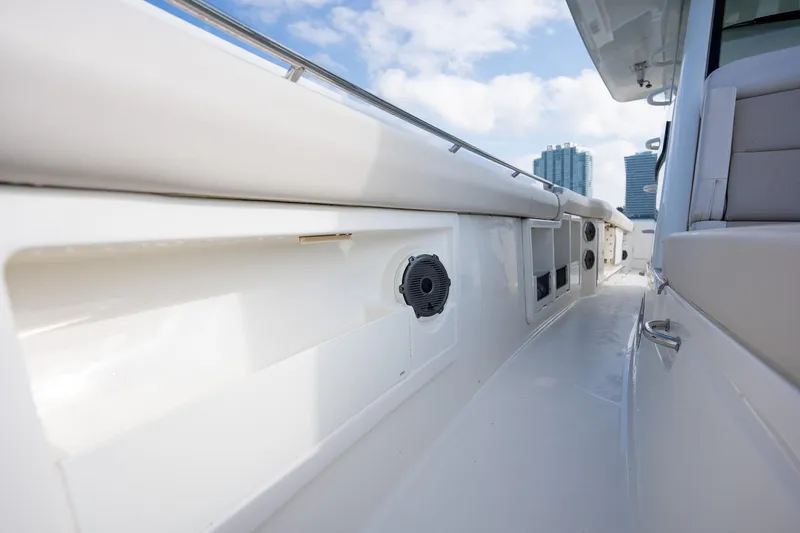 Slide: The Image of 2020 Boston Whaler 380 Outrage boat deck with speakers, city skyline in background. - 19