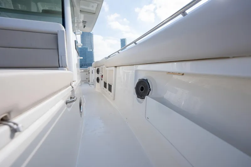 Slide: The Image of 2020 Boston Whaler 380 Outrage boat deck with modern design and city skyline background. - 20