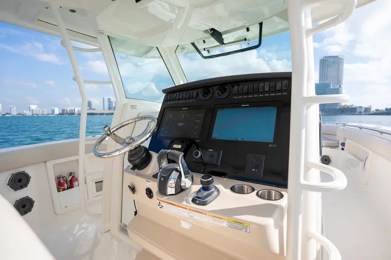Slide: The Image of Boston Whaler 380 Outrage 2020 helm with modern controls and ocean view. - 26