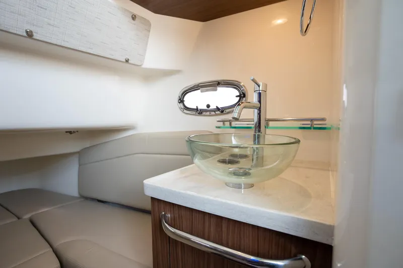 Slide: The Image of Luxurious bathroom interior of 2020 Boston Whaler 380 Outrage with modern glass sink. - 33