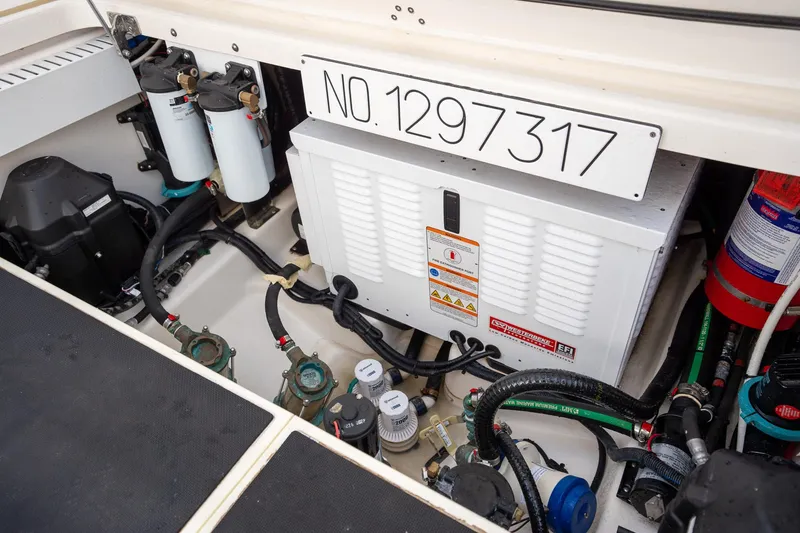 Slide: The Image of Engine compartment of a 2020 Boston Whaler 380 Outrage with equipment and wiring. - 39