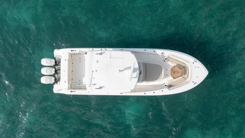 Slide: The Image of Aerial view of 2020 Boston Whaler 380 Outrage boat on clear blue water. - 5