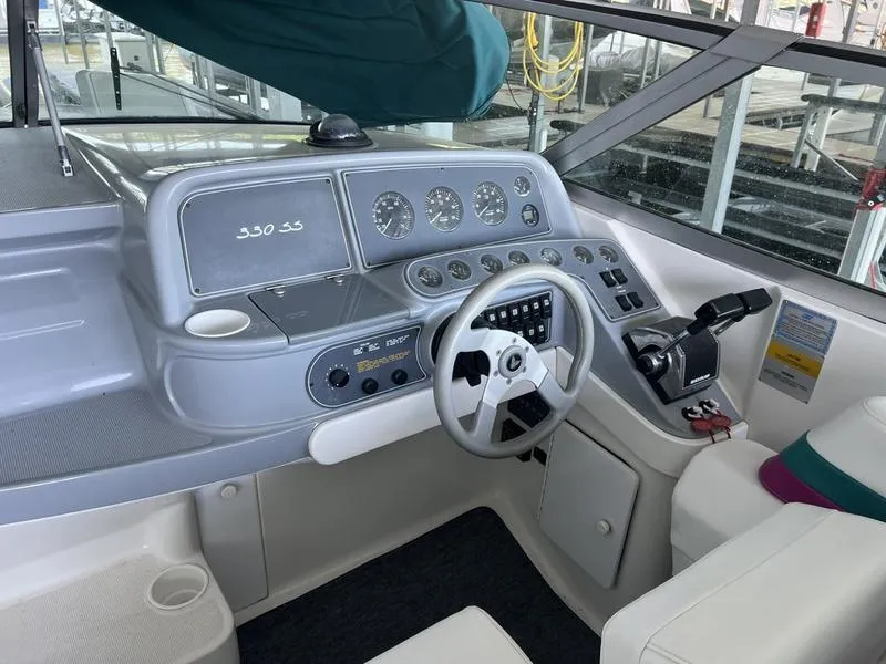Slide: The Image of 1996 Formula 330 SS boat cockpit with steering wheel and control panel. - 11
