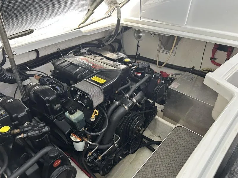 Slide: The Image of Engine compartment of a 1996 Formula 330 SS boat, showcasing detailed mechanical components. - 18