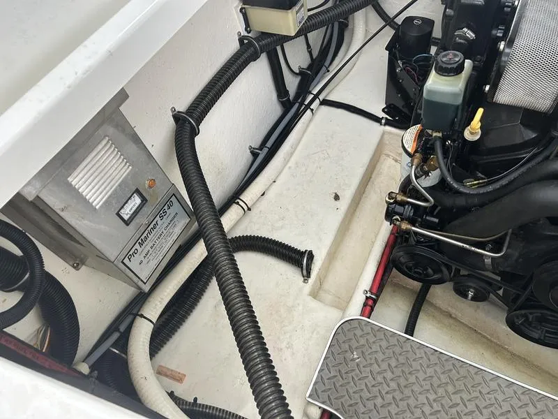 Slide: The Image of Engine compartment of a 1996 Formula 330 SS boat, featuring Pro Mariner SS 40 charger. - 19