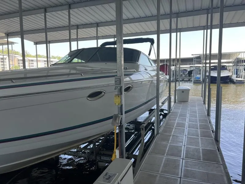 Slide: The Image of 1996 Formula 330 SS boat docked in a covered marina slip. - 4