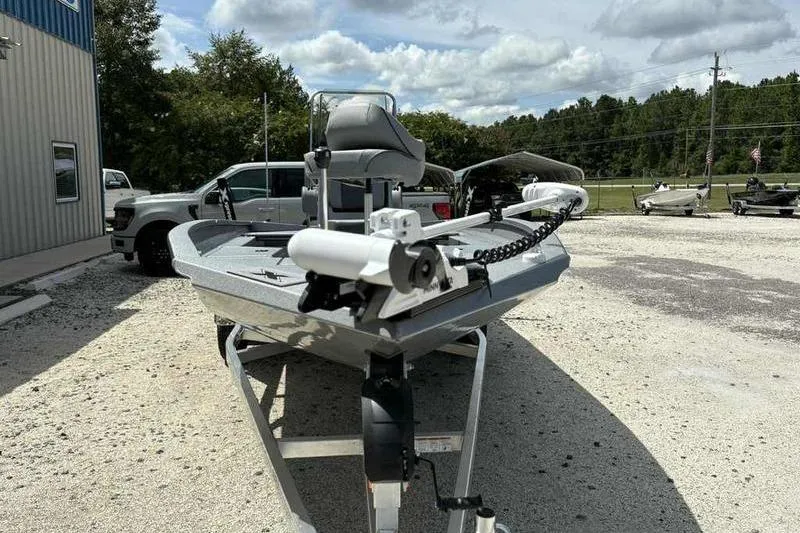 Slide: The Image of 2026 Xpress H22 Bay boat on trailer in outdoor setting. - 2