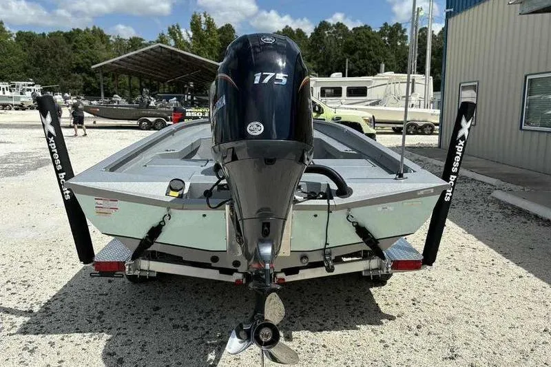 Slide: The Image of 2026 Xpress H22 Bay boat with 175 horsepower engine, parked outdoors. - 6