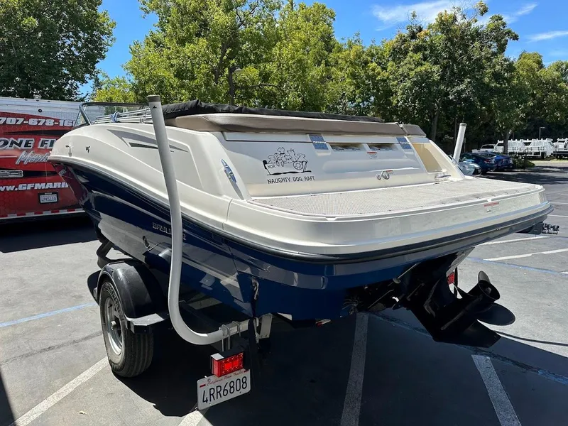Slide: The Image of 2017 Bayliner VR5 Bowrider boat on trailer in parking lot, sunny day. - 10
