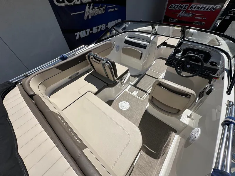 Slide: The Image of 2017 Bayliner VR5 Bowrider interior with beige seating and modern dashboard. - 14