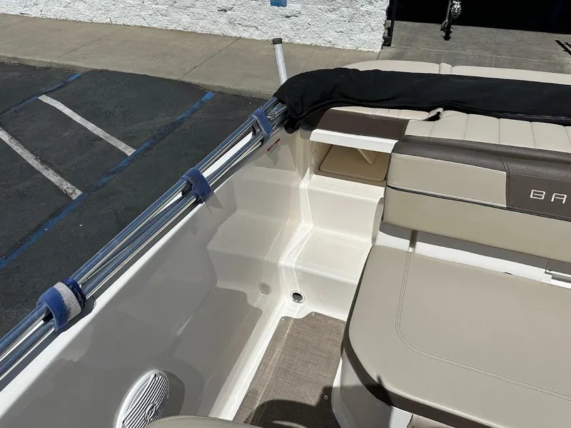 Slide: The Image of 2017 Bayliner VR5 Bowrider interior with beige seating and chrome railing. - 21