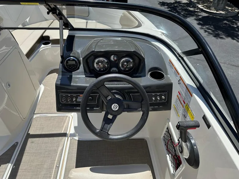 Slide: The Image of 2017 Bayliner VR5 Bowrider dashboard with steering wheel and control panel. - 23