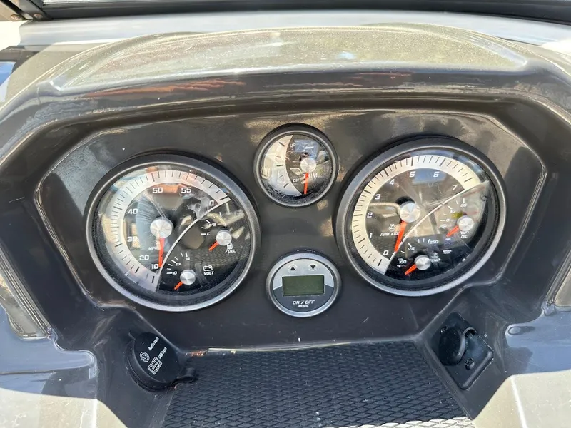 Slide: The Image of Dashboard of a 2017 Bayliner VR5 Bowrider boat with speedometer and tachometer gauges. - 26