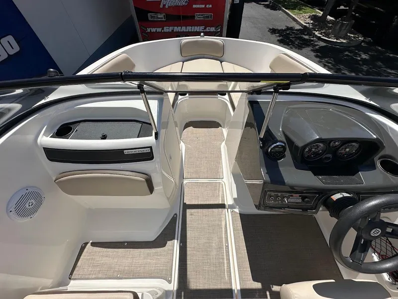 Slide: The Image of 2017 Bayliner VR5 Bowrider interior with dashboard, seating, and steering wheel. - 27