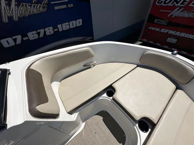 Slide: The Image of 2017 Bayliner VR5 Bowrider interior with beige seating and cup holders. - 30