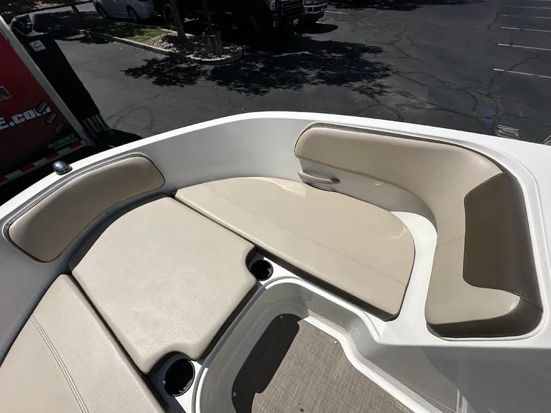 Slide: The Image of 2017 Bayliner VR5 Bowrider interior with beige seating and cup holders. - 31