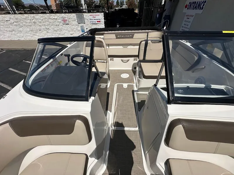 Slide: The Image of 2017 Bayliner VR5 Bowrider interior with beige seating and open deck layout. - 35
