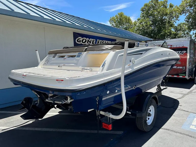 Slide: The Image of 2017 Bayliner VR5 Bowrider boat on trailer, parked outdoors. - 8