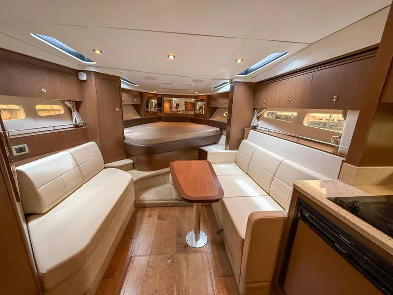 Slide: The Image of Luxurious interior of 2016 Sea Ray 350 Sundancer yacht with elegant seating and wood finishes. - 19