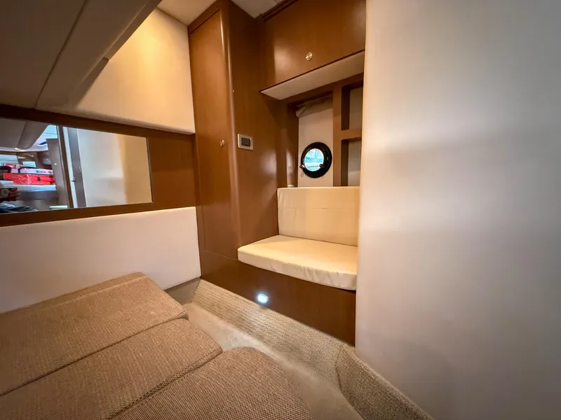 Slide: The Image of Interior of 2016 Sea Ray 350 Sundancer yacht, featuring cozy seating and modern design. - 30