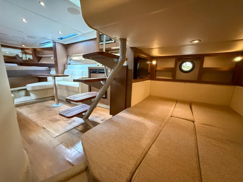 Slide: The Image of Interior of 2016 Sea Ray 350 Sundancer yacht, featuring cozy seating and modern design. - 32