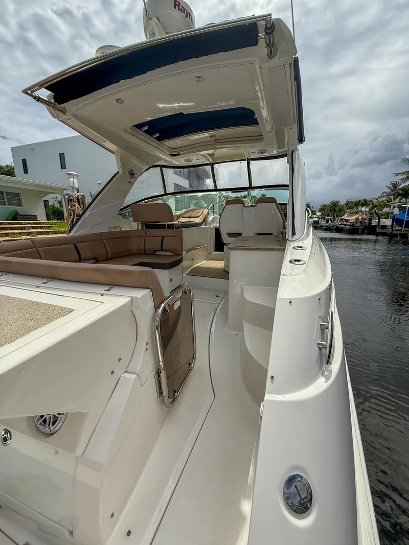 Slide: The Image of 2016 Sea Ray 350 Sundancer yacht with spacious deck and luxurious seating. - 5