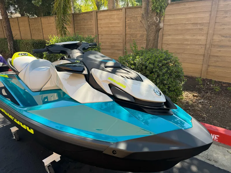 Slide: The Image of 2025 Sea-Doo GTI SE 170 jet ski in vibrant blue, parked outdoors. - 4