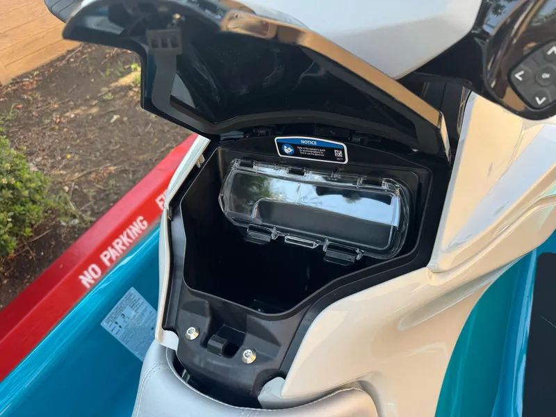 Slide: The Image of 2025 Sea-Doo GTI SE 170 storage compartment open, showcasing interior design. - 6