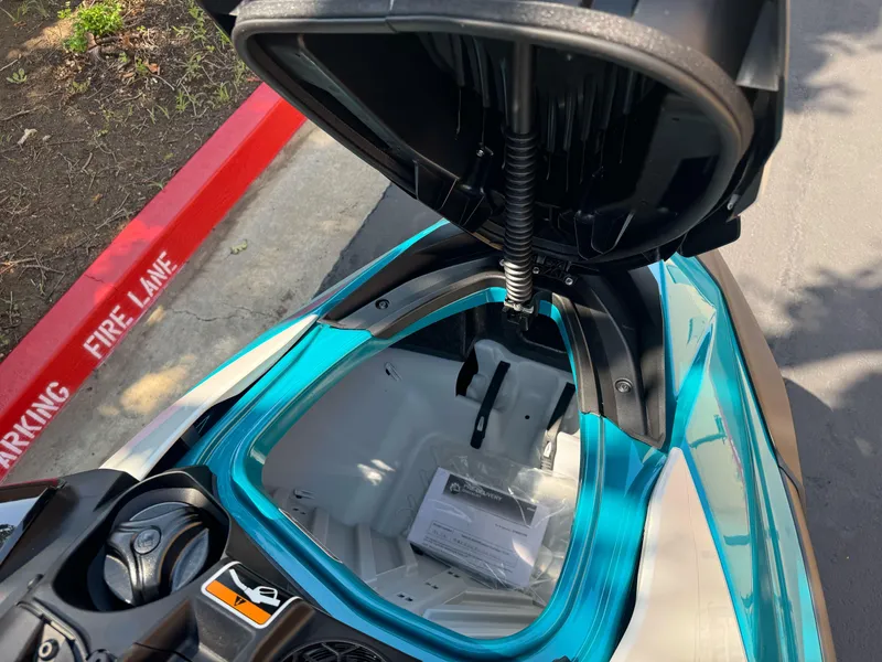 Slide: The Image of 2025 Sea-Doo GTI SE 170 storage compartment open, showcasing interior space. - 7