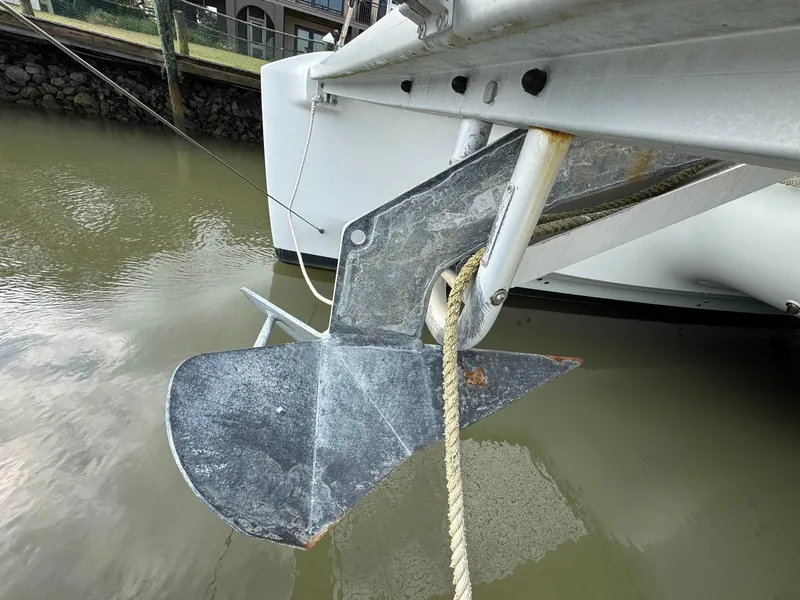 Slide: The Image of Anchor of 2022 Lagoon 46 catamaran in water, close-up view. - 13